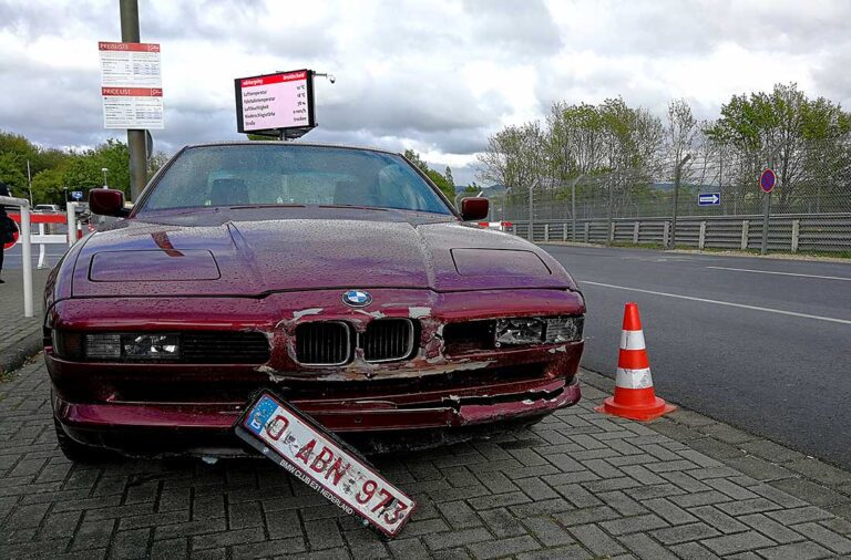 A BMW E31 8 series at the nurburgring with a crashed front end