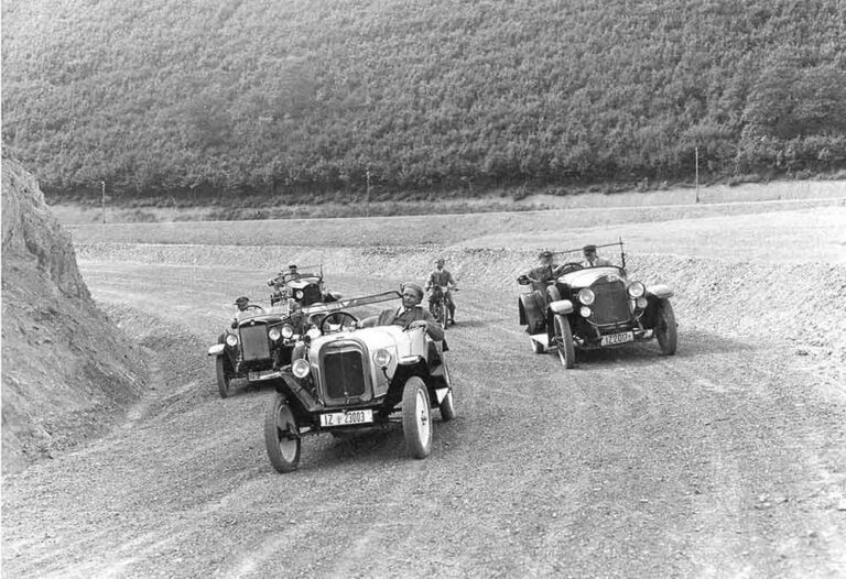 Journalists do a lap of the Nurburgring in June 1927 durings it opening cermony. It cost around 14 Million Reichsmarks to build.