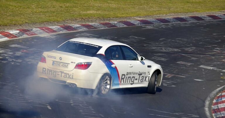 An E60 M5 driven by Sabine Schmitz drifts on the Nordschleife
